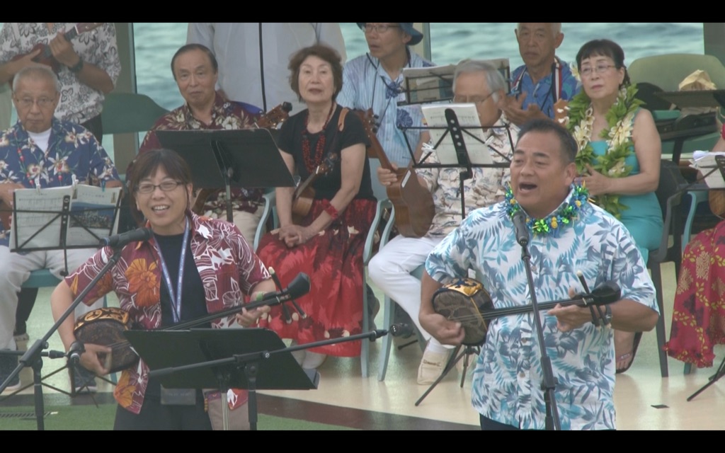 Tom Yamamoto performs ukulele on board